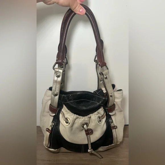 B. Makowsky Cream, Black, & Metallic‎ Pebbled Leather Hobo Bag.