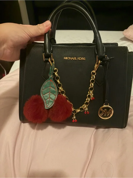 Michael Kors Black Leather Satchel with Red Pom Pom and Green Leaf Charm