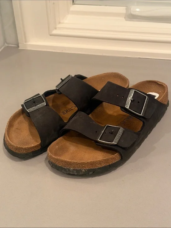 Birkenstock Arizona Two-Strap Sandals in Dark Brown with Tan Footbed