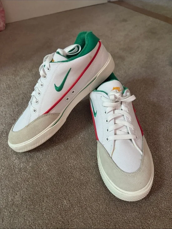 Nike White Sneakers with Green Swoosh and Red Stripe