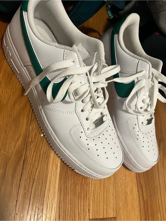 Nike White Sneaker with Dark Green Swoosh Accent