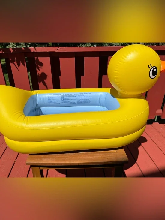 Yellow Inflatable Baby Pool with Light Blue Interior. Used for bathing /party