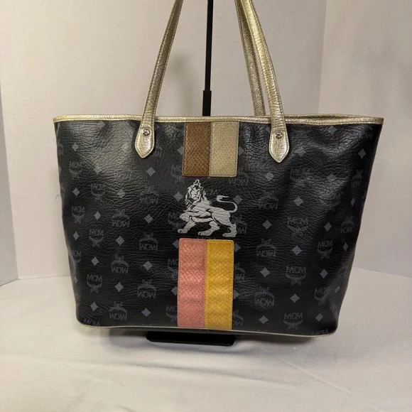 MCM Visetos Monogram Medium Tote Bag Black Gold‎ Lion Graphic Striped