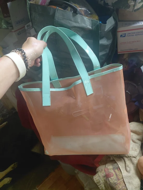 peach-colored mesh tote bag from the Clinique 