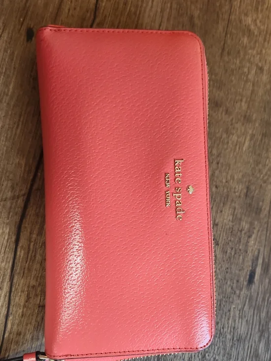 kate spade coral zip-around wallet with gold logo