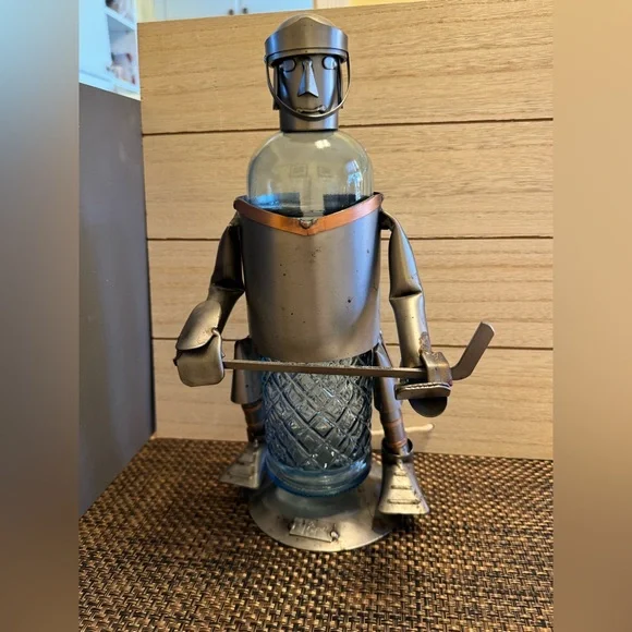 H&K steel sculpture hockey player wine bottle holder