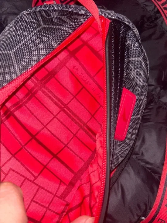 Unisex Black and Red Tumi staple crossbody