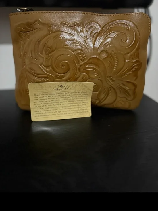 Authentic brand new Patricia Nash clutch in the color biscuit- never used-perect