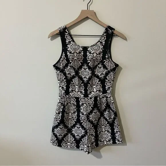 Lush  romper one piece Size small fun all over print sleeveless date