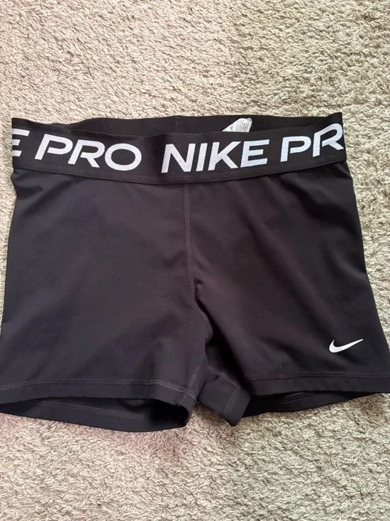 Nike Black Compression Shorts with White Swoosh Detail