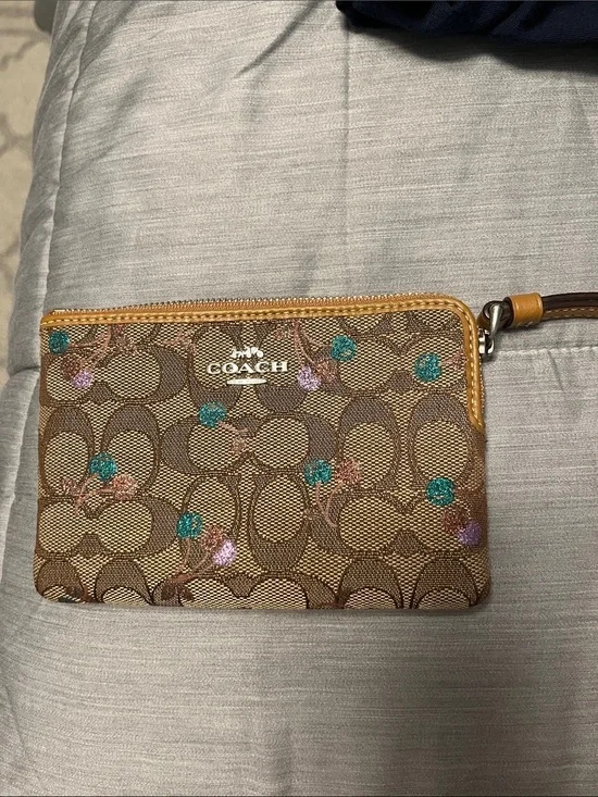 COACH Signature Canvas Floral Wristlet in Brown