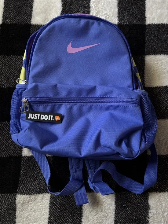 Nike Blue Sling Backpack with Pink Swoosh and Yellow Strap Accent