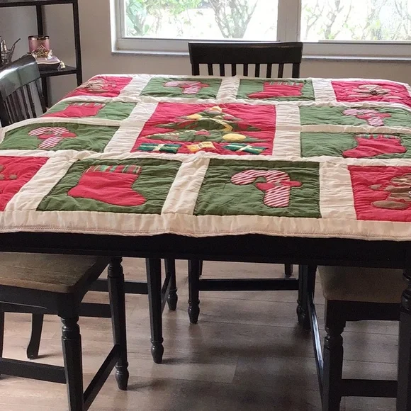 Handmade Christmas-themed applique quilt