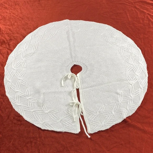 Hand-Knit White Circular underneath the Christmas tree stand cover. 25 in length