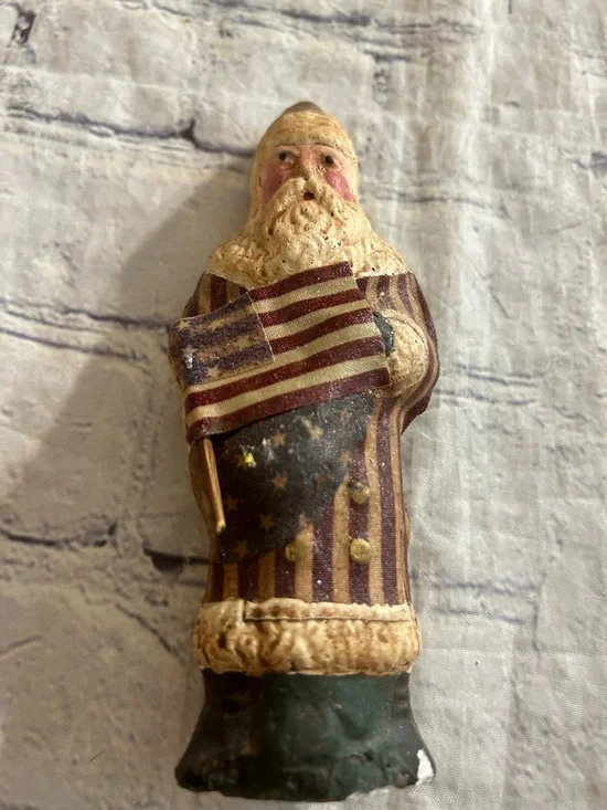 VINTAGE FOLK-ART STYLE PATRIOTIC SANTA OR BELSNICKEL FIGURINE WEARING A FLAG