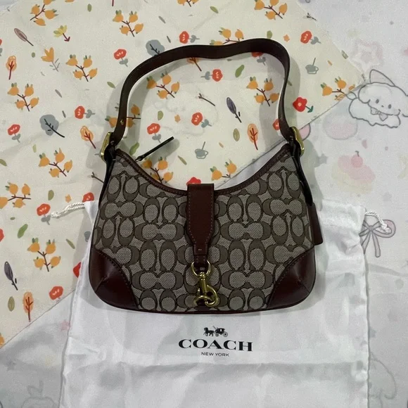 Coach Brown Signature Canvas Shoulder Bag with Brass Hardware