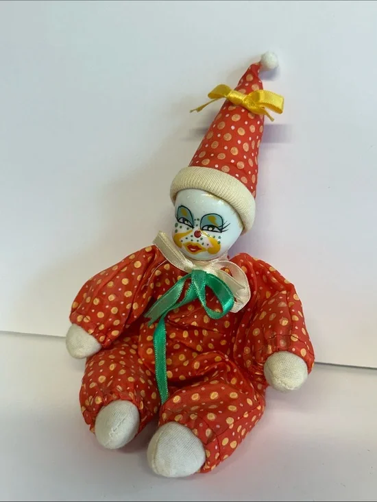 Red porcelain clown doll