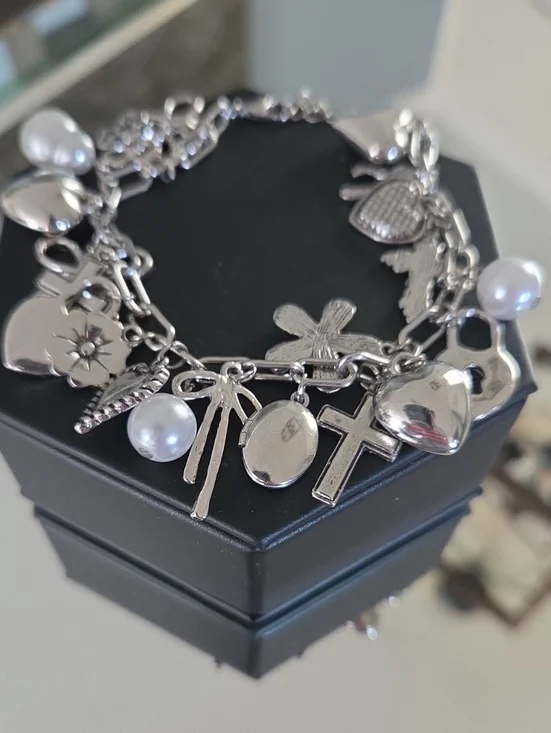 Stainless Steel Silver Charm Bracelet with Faux Pearls and Adorable Charms.