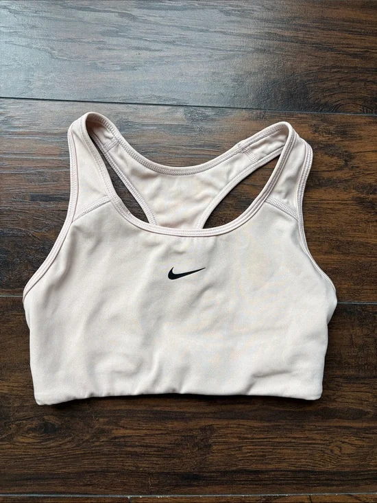 Nike Women’s light beige Racerback Sports Bra with Black Swoosh