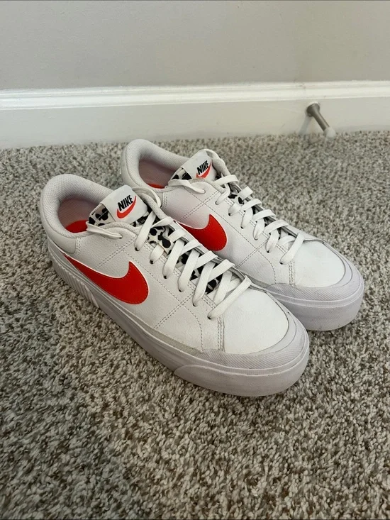 Nike Men’s White Sneakers with Red Swoosh and Leopard Tongue Detail