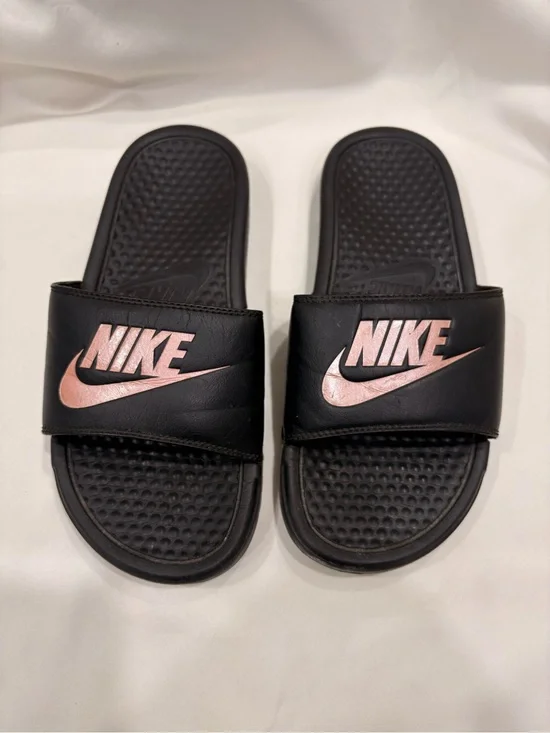 Woman’s Nike Benassi Black and Rose Gold Slides Size 7