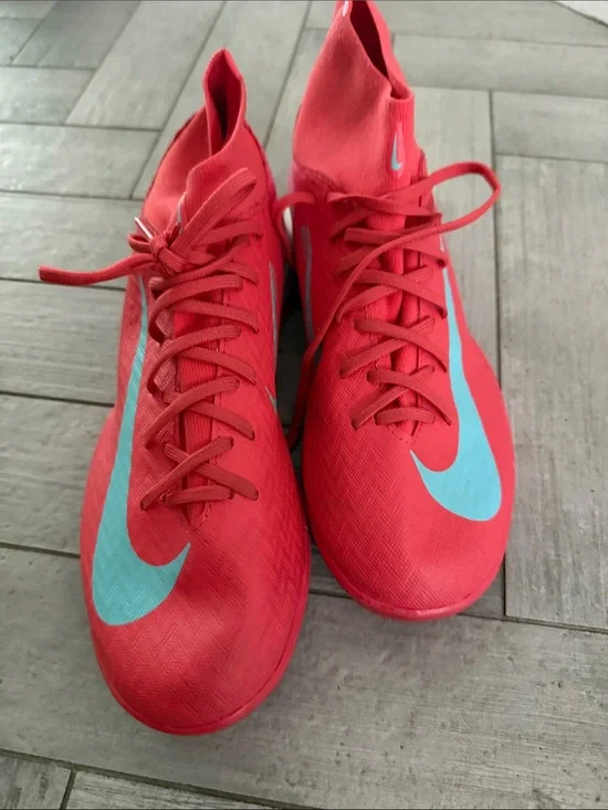 Nike Red Soccer turf Cleats with Teal Swoosh Accents