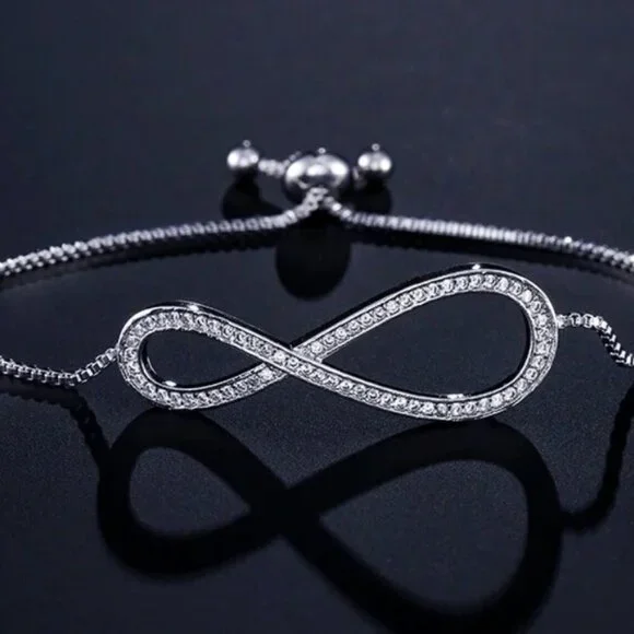 Jewelry bracelet infinity style white gold tone with stones sparkly adjustable
