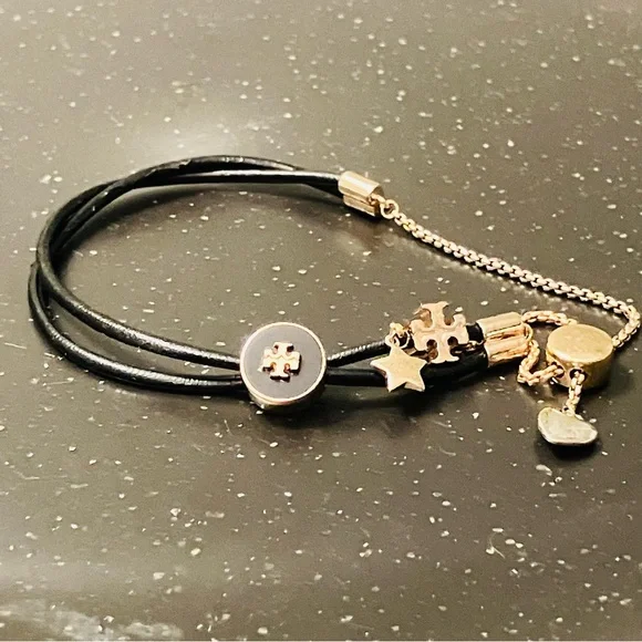 Tory Burch-Kira Double Leather Slider Bracelet in Black and Gold. Shows min wear