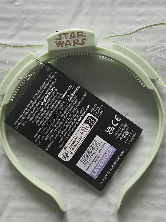 Disney Parks Star Wars Grogu ears headband feature translucent light-up ears.