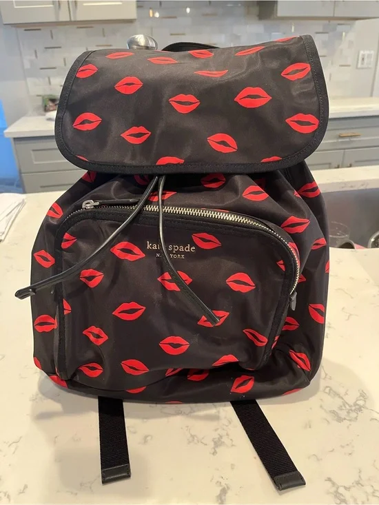 kate spade Black Backpack with Red Lip Print Pattern