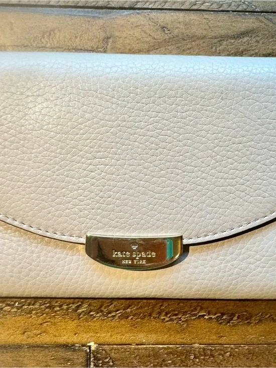 kate spade Cream Pebbled Leather Wristlet with Gold-Tone Plaque
