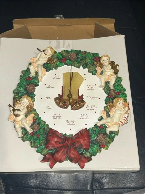 Musical Christmas Wreath Clock with Cherubs, sings a different song every hour