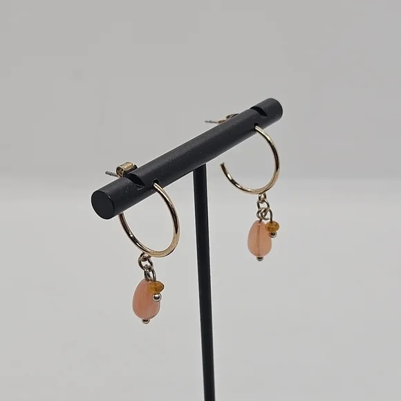 small gold tone hoop earrings with pink and orange beads