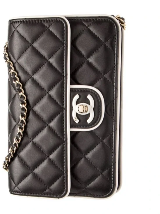 CHANEL Black Quilted Leather Shoulder Bag with White Trim and Gold Chain
