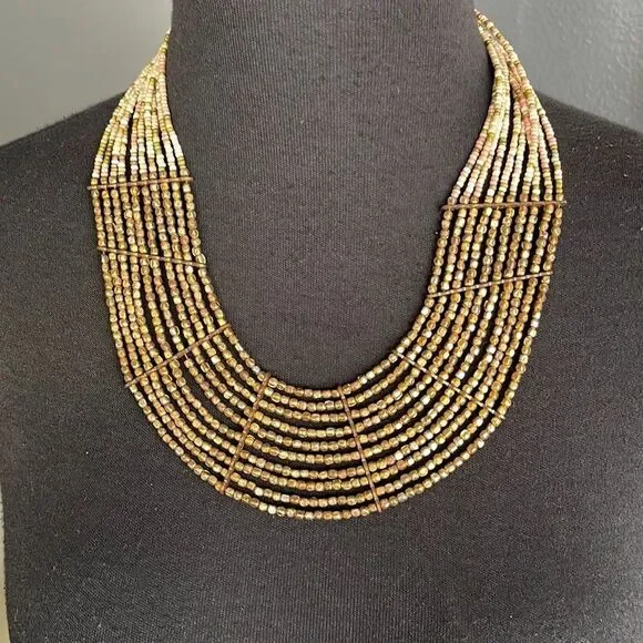 Multi strand bronze and pastel bead necklace.