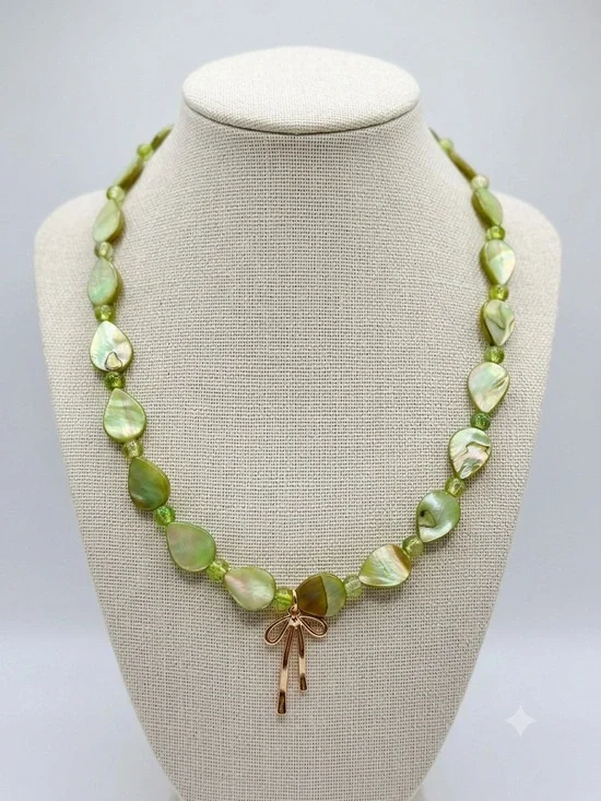 Green Mother-of-Pearl Teardrop Necklace with Gold Bow Accent