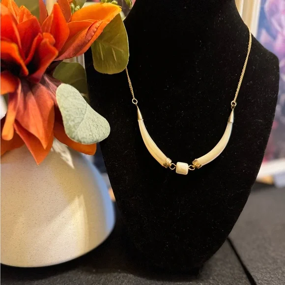 Vintage mother of pearl horn shaped necklace with gold tone end caps and chain