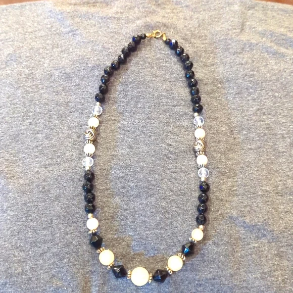 Women's black, pink‎ and clear ball necklace.