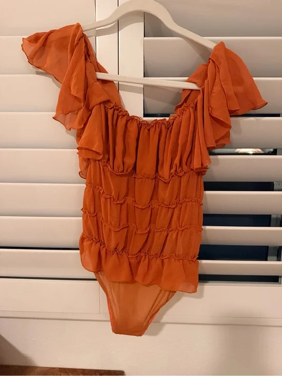 Free People Orange Ruffled Bodysuit XS Womens - never been worn