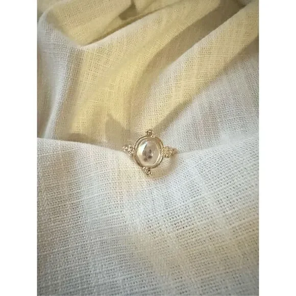 Size 8 oval cut iridescent ring