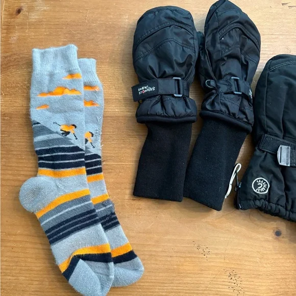 2 pairs of black ski mittens and   ski socks for ages 4-6