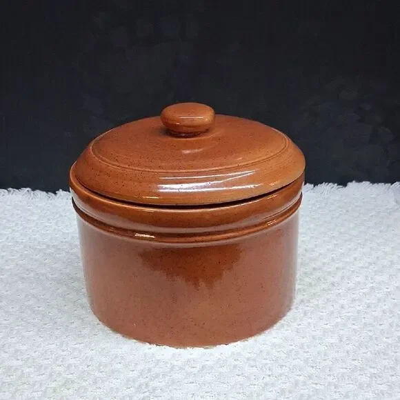 Vintage pottery crock bowl with lid with‎ brown speckled glaze finish.