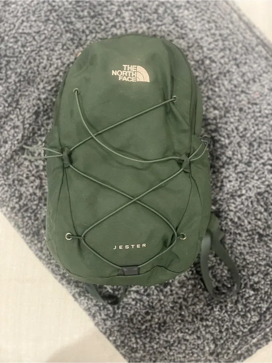 The North Face Jester Backpack in Dark Green with White Logo