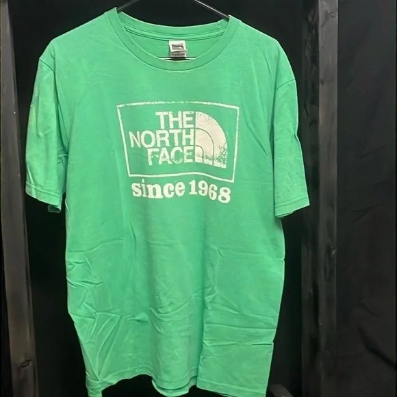 The North Face- green shirt with cream logo on front