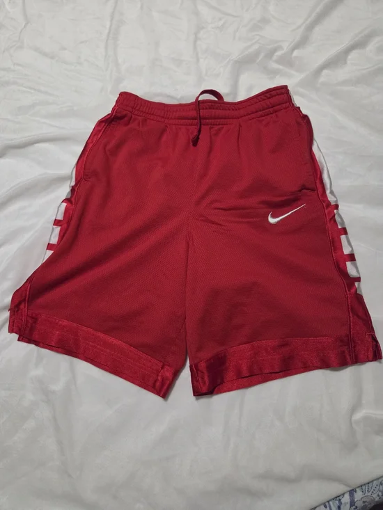 Nike Red Mesh Athletic Shorts with White Swoosh and Side Panels