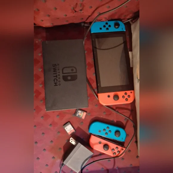 Nintendo Handheld Console with Blue and Red Controllers