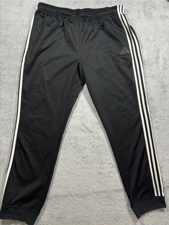 Adidas black track pants with white stripes