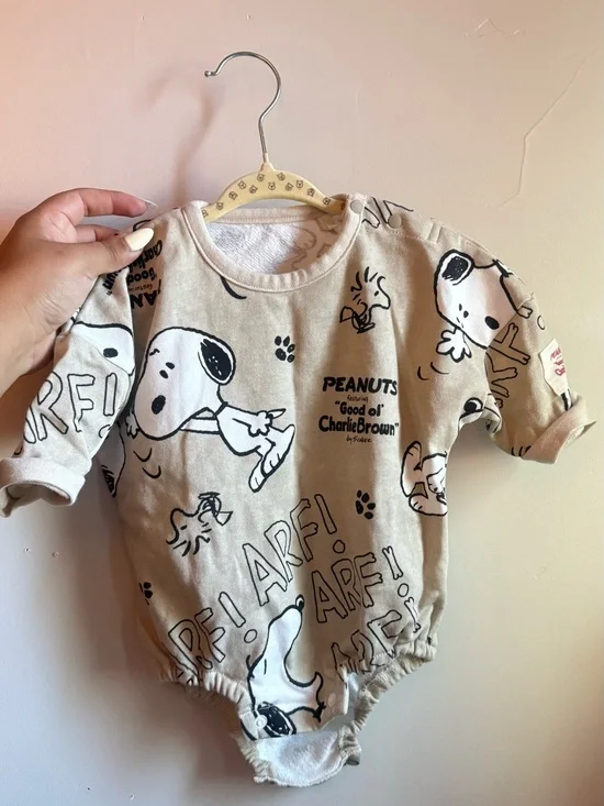 Peanuts Snoopy Cream Baby Onesie with Black Graphics