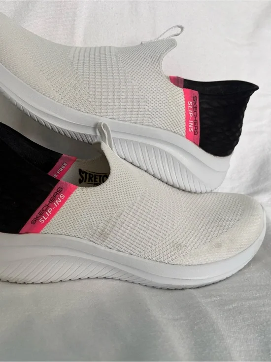 Skechers Women’s White Slip-On Athletic Sneakers with Pink and Black Accents