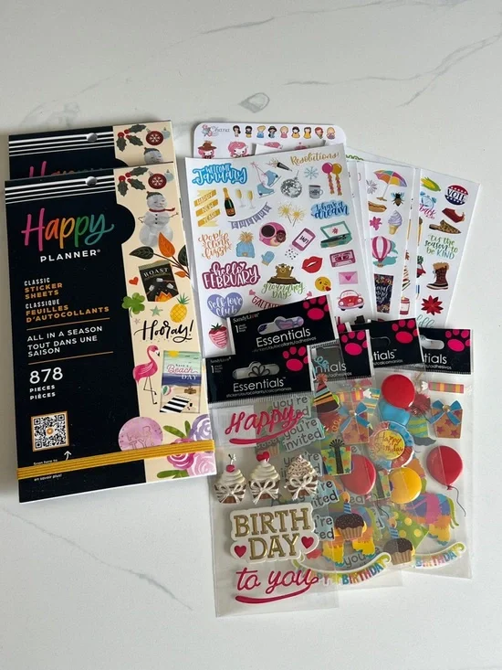 Happy Planner sticker books and various seasonal stickers